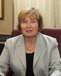 woman in blazer at desk